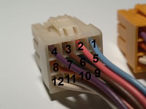 Male 12 pin AMP UP connector with pin numbering.