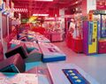 row of Arena Sight cabs in Namco's Wonder City amusement complex, Japan, 1996
